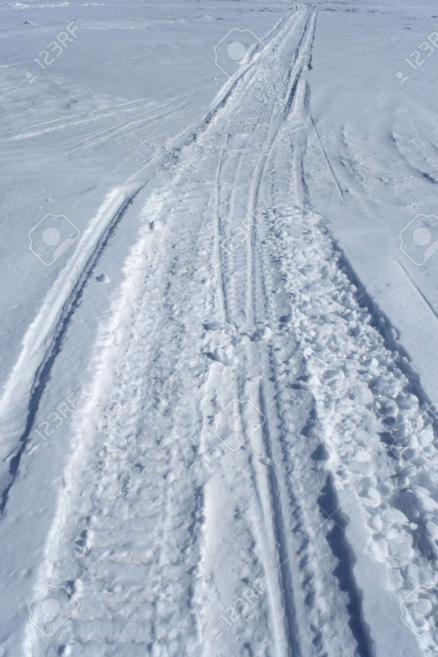 845989-Skidoo-track-crossing-the-snowy-winter-terrain--Stock-Photo-tracks.jpg