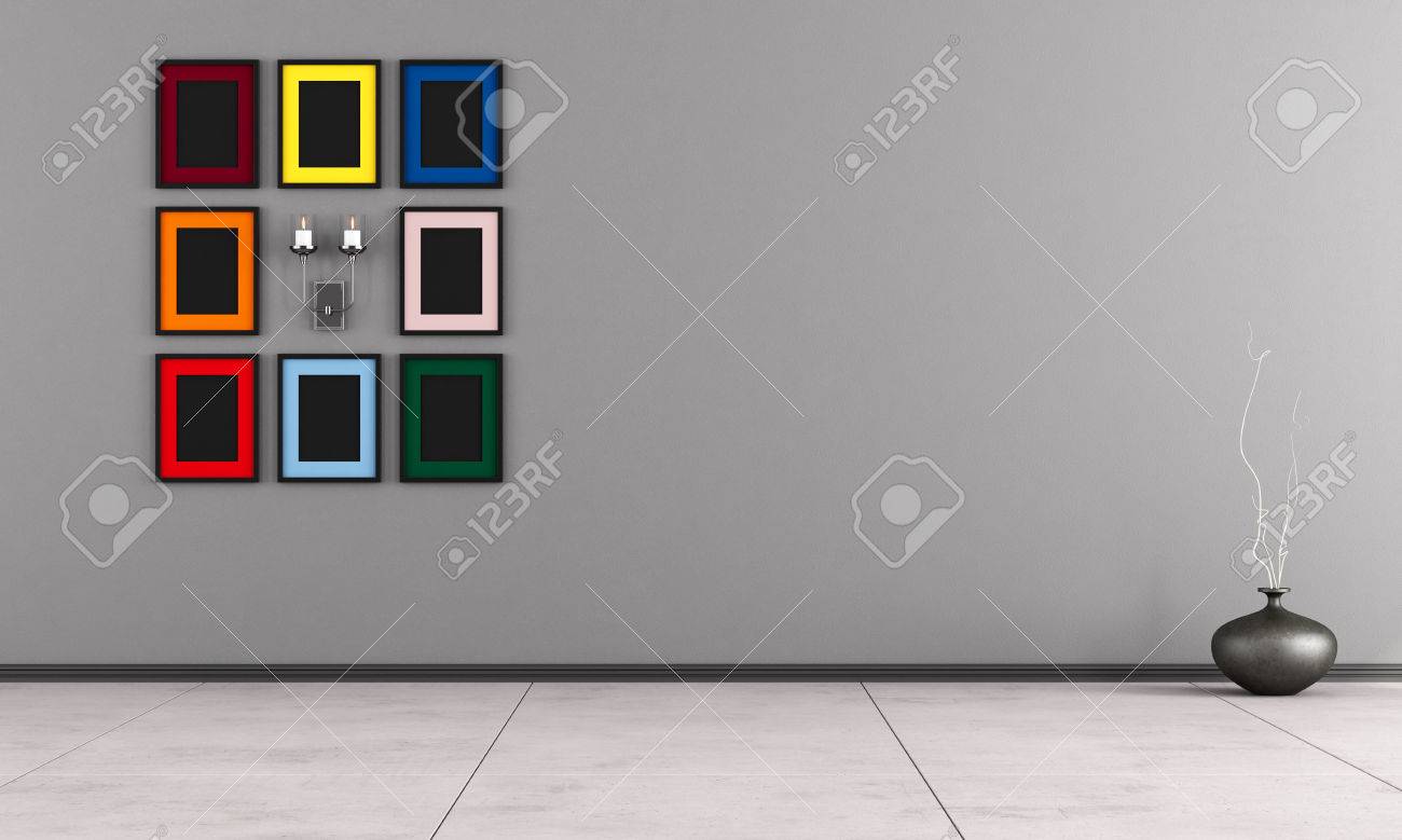 Chambre minimaliste avec cadre coloré et bougie sur le mur gris ...