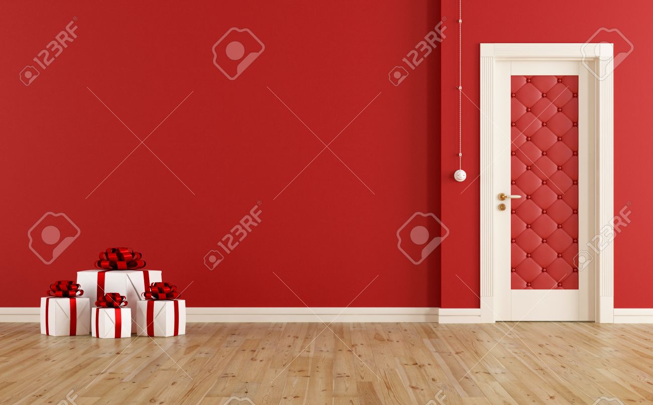 Chambre rouge avec la porte fermée et le présent de noël sur ...