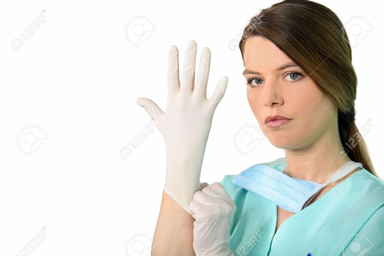 -Nurse-putting-on-latex-gloves-Stock-Photo