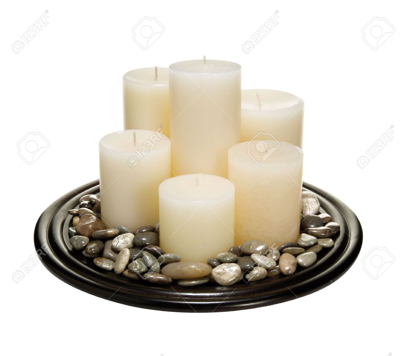 stock photo candles on a bed of rocks zen home decor