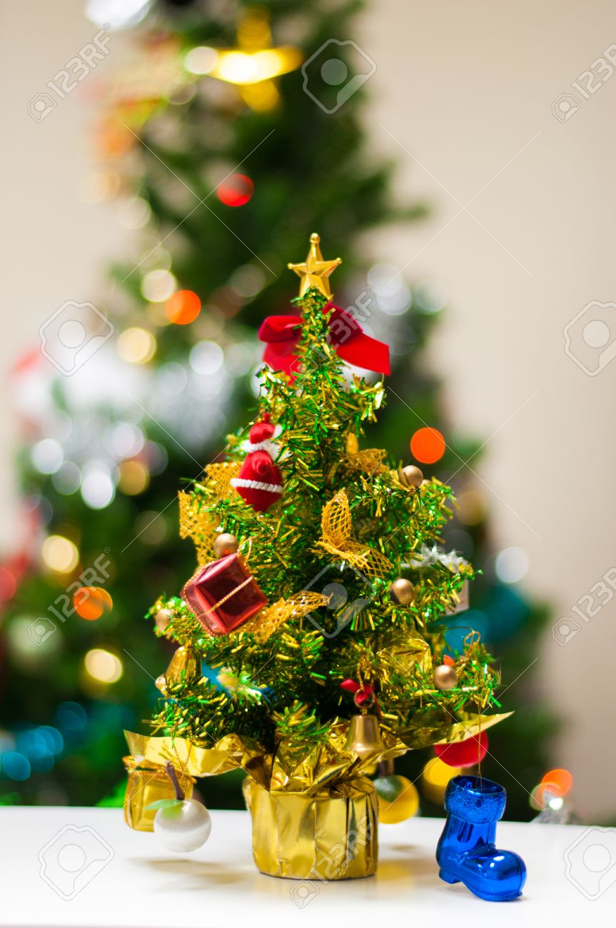 Desk Xmas Tree Stock Photo - Mini Christmas tree on office desk