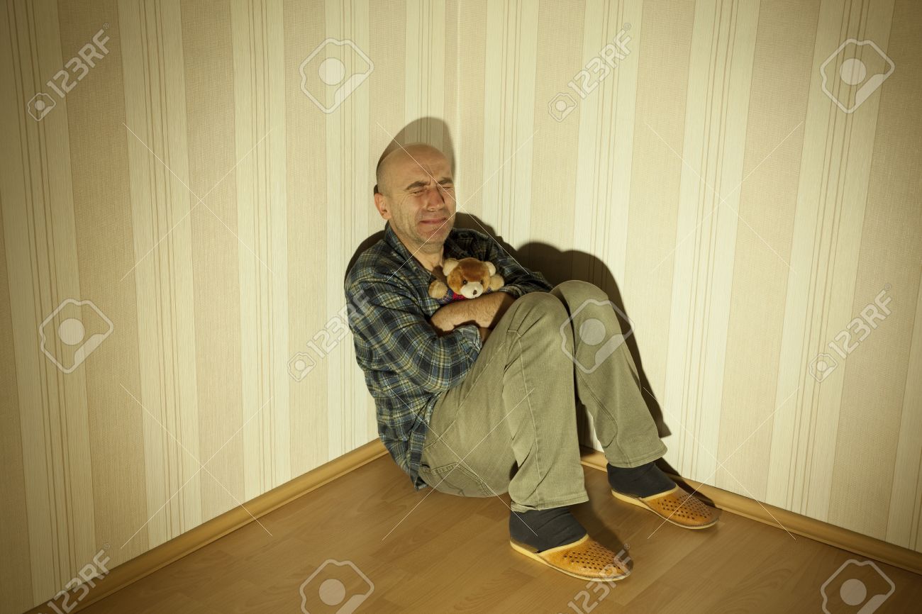 12358212-lonely-man-in-angle-ill-on-depression-Stock-Photo.jpg