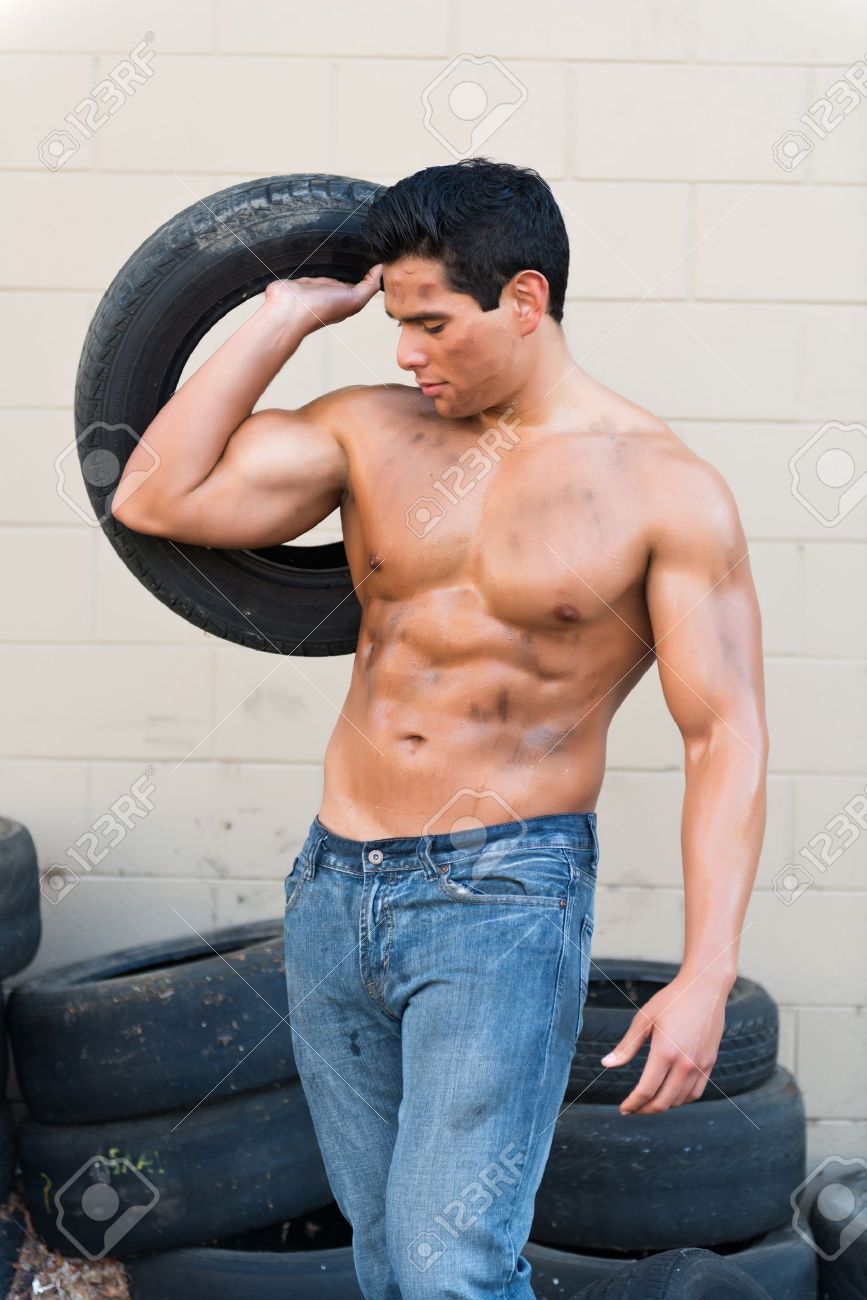 15199279-athletic-young-man-with-auto-tires-handsome.jpg