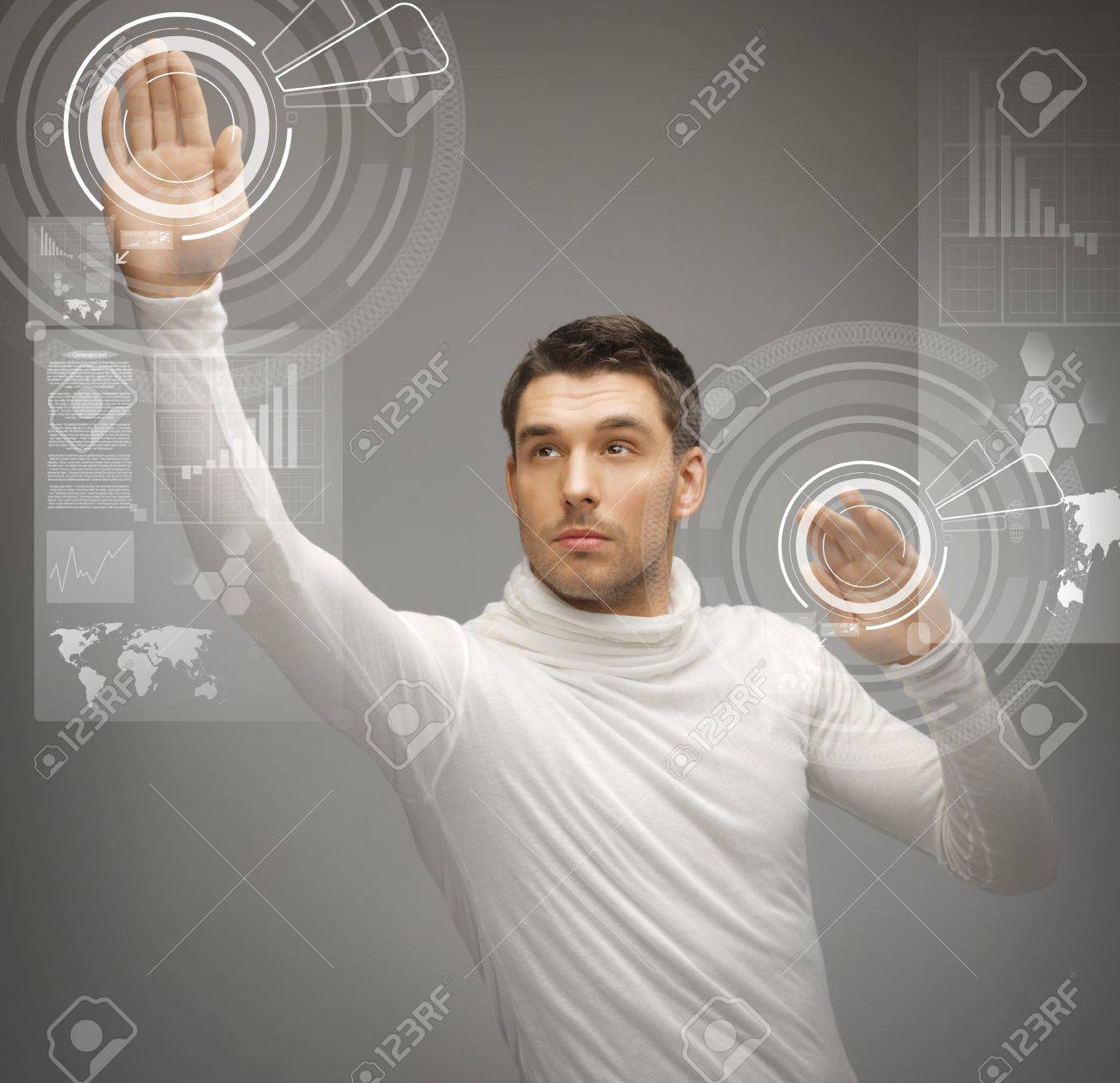 19146338-picture-of-futuristic-man-working-with-virtual-screens-Stock-Photo.jpg