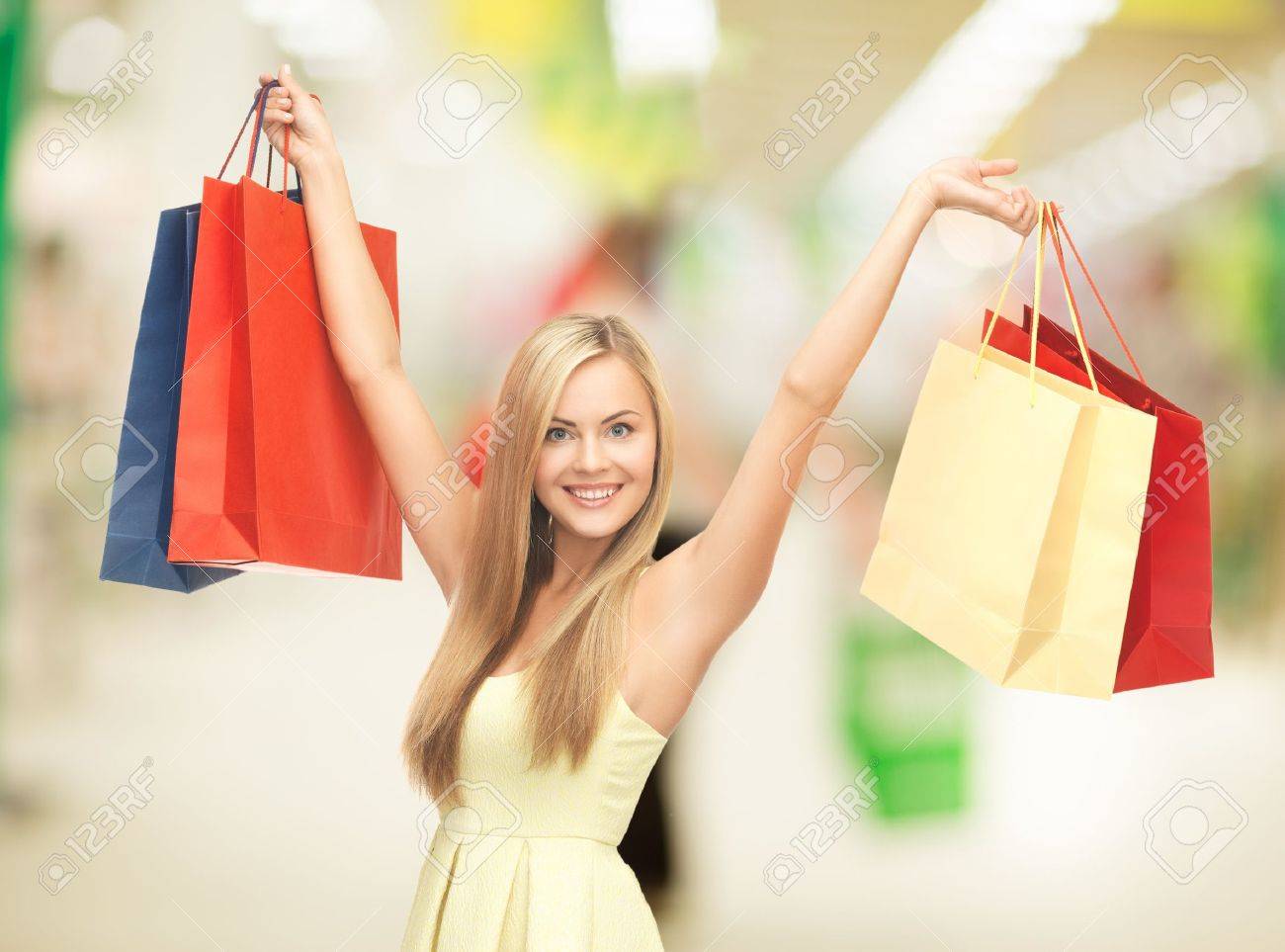 http://previews.123rf.com/images/dolgachov/dolgachov1307/dolgachov130700397/20623563-happy-woman-with-shopping-bags-at-the-mall-Stock-Photo.jpg
