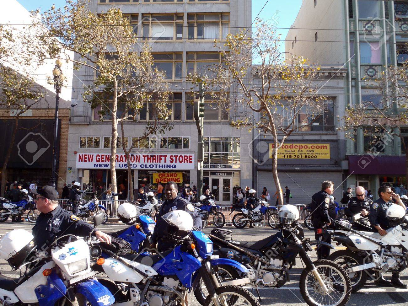10104785-SAN-FRANCISCO-CA-NOVEMBER-3-Police-officers-and-motorcycle-hang-out-on-a-closed-market-street-keepin-Stock-Photo.jpg