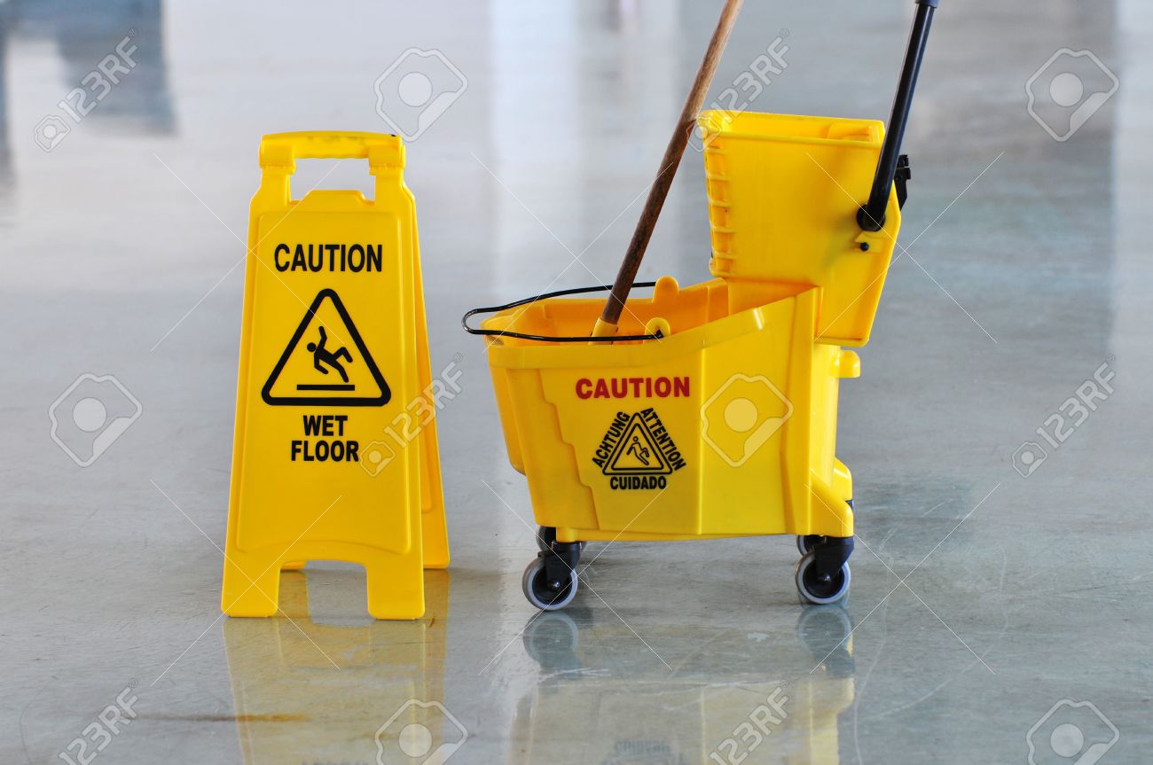 7972557-Mop-bucket-and-caution-sign-on-wet-floor-Stock-Photo-janitorial-slippery-sign.jpg