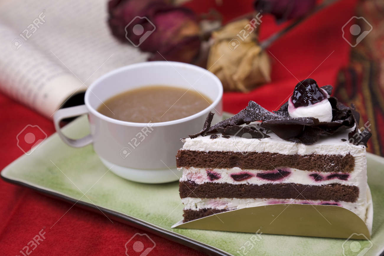 6237695-Relaxing-with-novel-coffee-and-cake-Stock-Photo.jpg