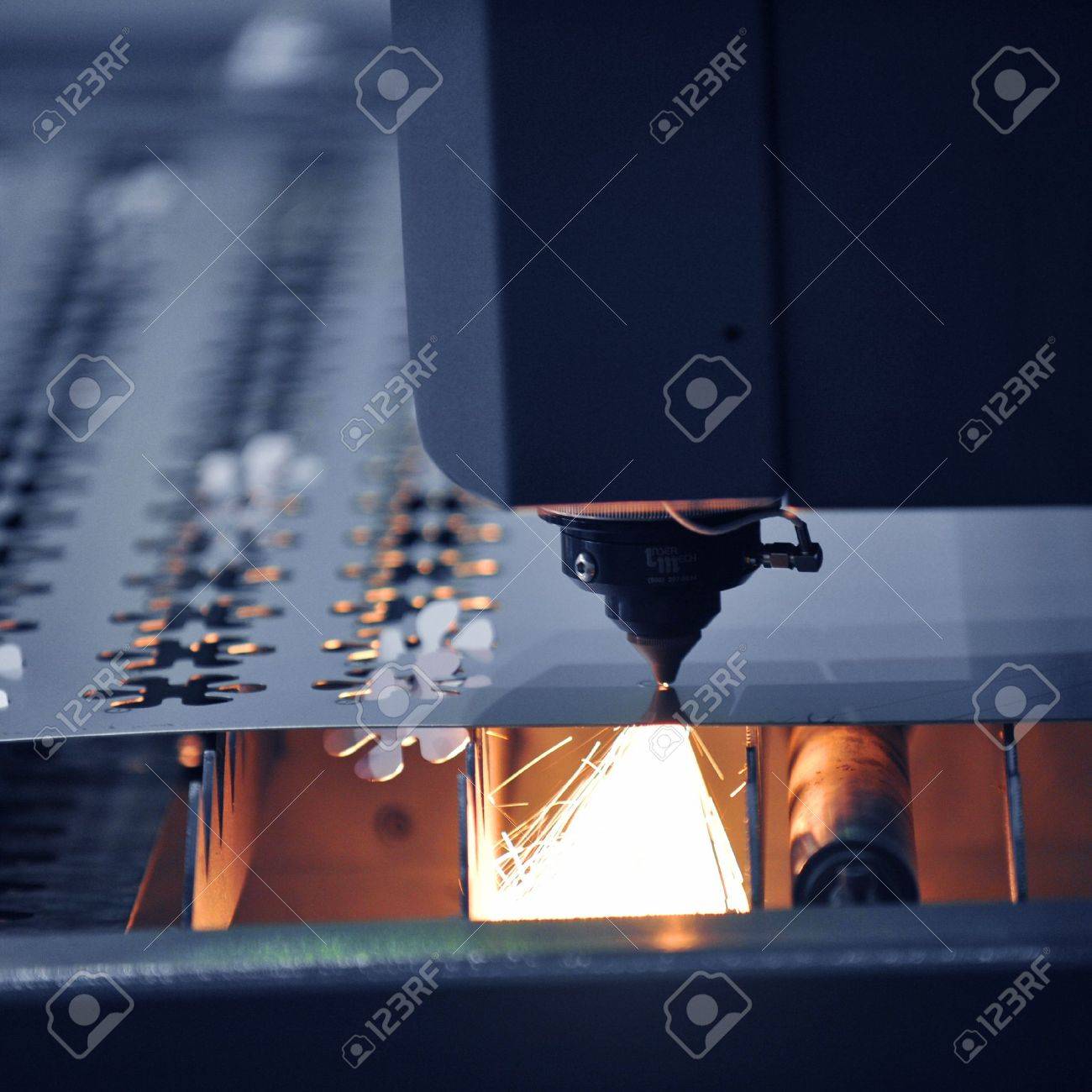 14248267-Industrial-laser-cutter-with-sparks--Stock-Photo-laser-cutting-cnc.jpg