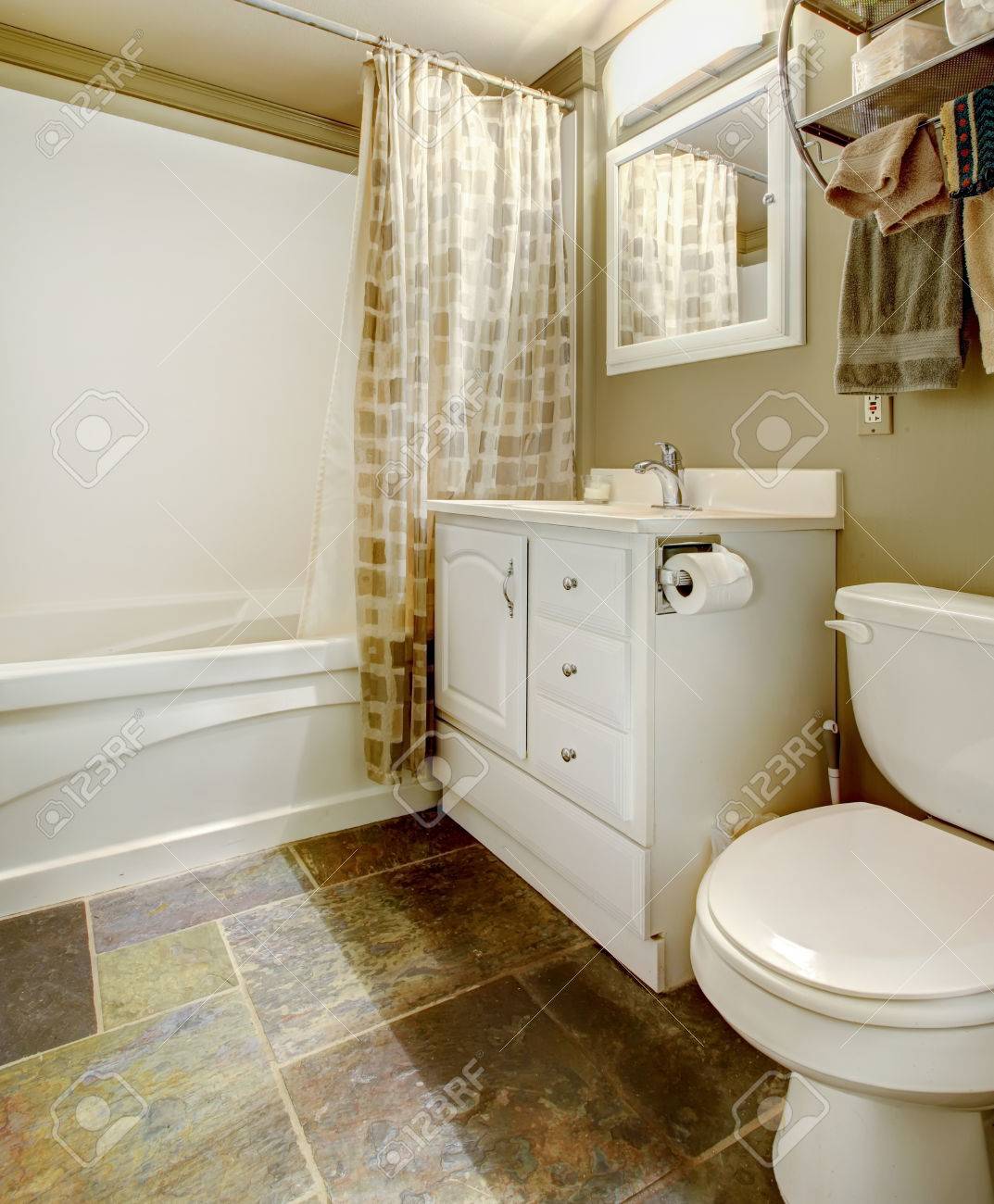 White And Brown Bathroom With Tile Floor And White Tub, Toilet White And Brown Bathroom With Tile Floor And White Tub, Toilet