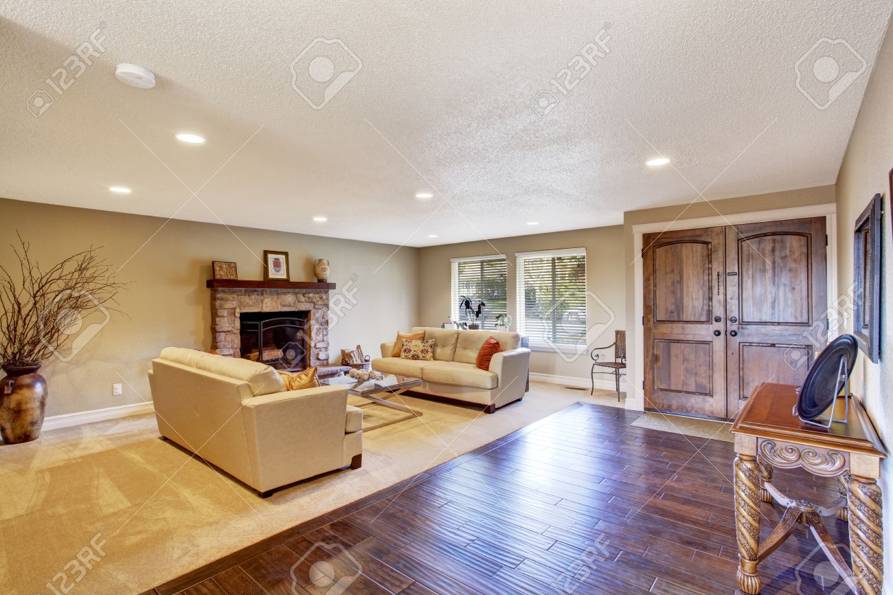 Living Room Two Couches In A Living Room light tones living room with fireplace and two couches view stock photo of entrance hall carved wood table