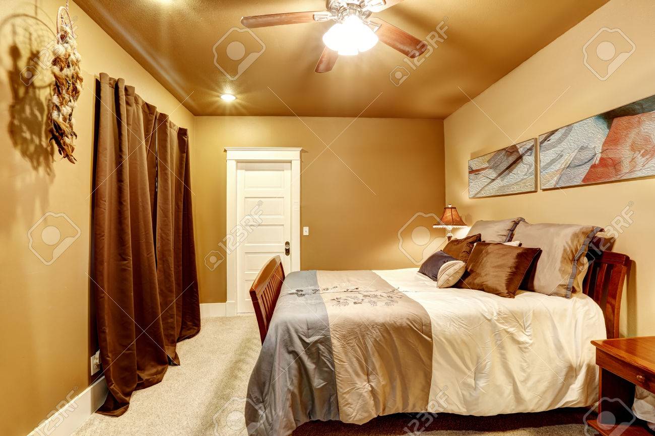 Warm Tones Bedroom With Comfortable Bed And Neutral Color Bedding Warm Tones Bedroom With Comfortable Bed And Neutral Color Bedding