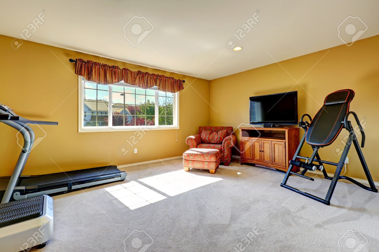 Home Gym Room With Exercise Equipments, Tv And Resting Area With Home Gym Room With Exercise Equipments, Tv And Resting Area With