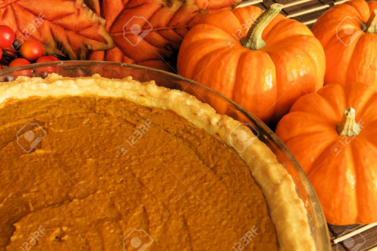http://previews.123rf.com/images/jenifoto/jenifoto1110/jenifoto111000065/10881167-Fresh-pumpkin-pie-in-a-pie-plate-with-pumpkins-and-autumn-leaves-in-the-background-Stock-Photo.jpg