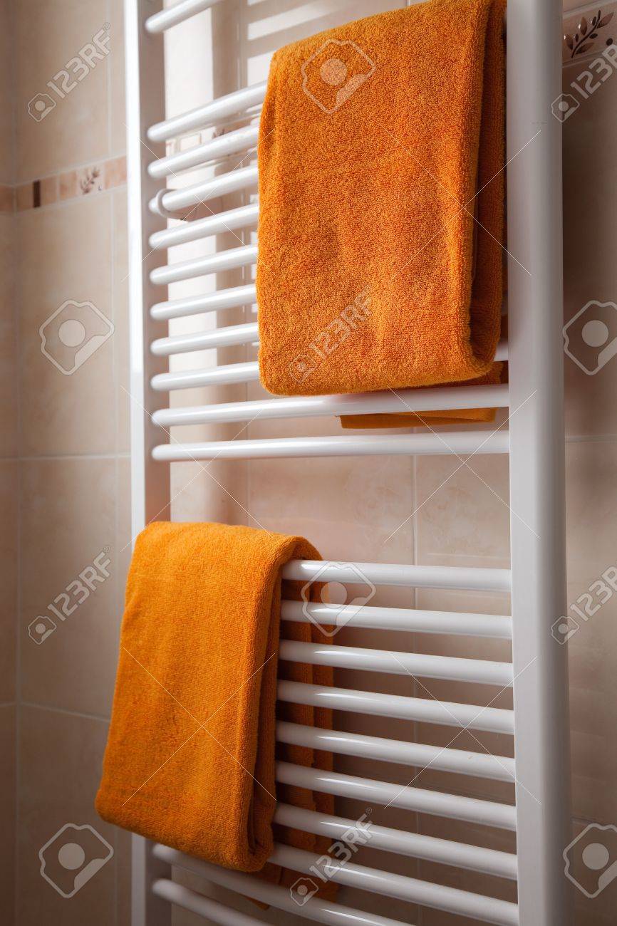 Bathroom Heating heating a bathroom. heating bathroom orange towels heater stock Bathroom Heating heating a bathroom. heating bathroom orange towels heater stock