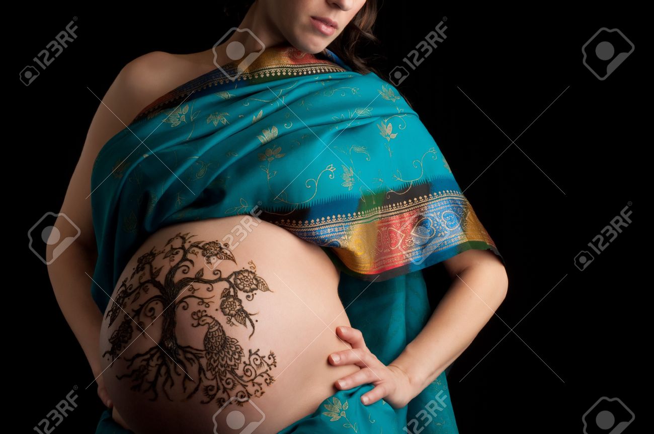 A color photo of a henna tree of life design on a woman s pregnant ...