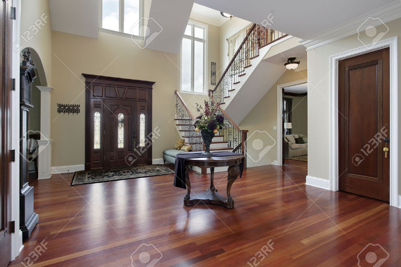 Foyer in luxury home with cherry wood flooring stock photo ...
