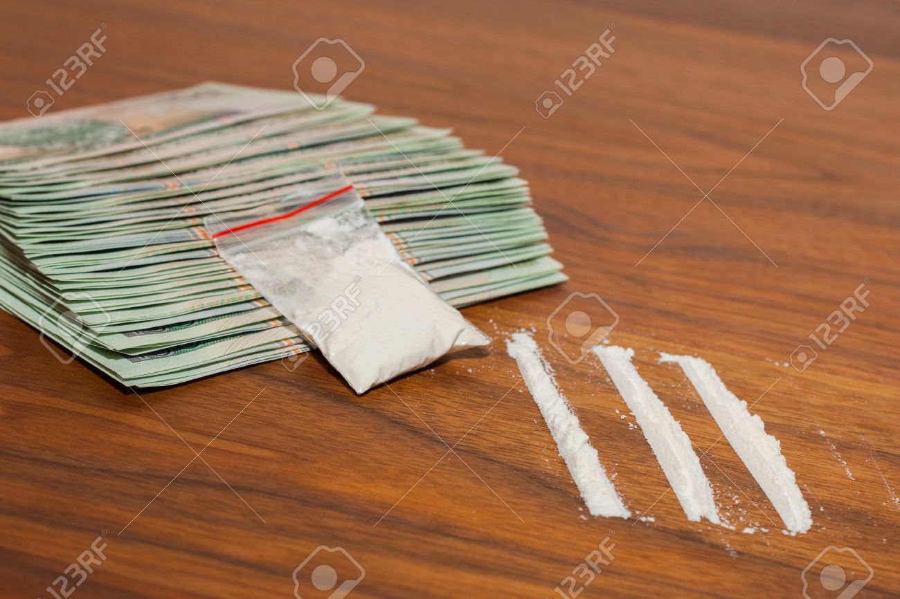 http://previews.123rf.com/images/lucasdm/lucasdm1210/lucasdm121000026/15654633-A-lot-of-money-and-drugs-narcotic-cocaine-on-a-wooden-table-Polish-zloty--Stock-Photo.jpg