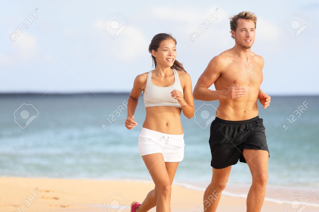 http://previews.123rf.com/images/maridav/maridav1304/maridav130400114/19226464-Couple-running-Sport-runners-jogging-on-beach-working-out-smiling-happy-Fit-male-fitness-model-and-a-Stock-Photo.jpg