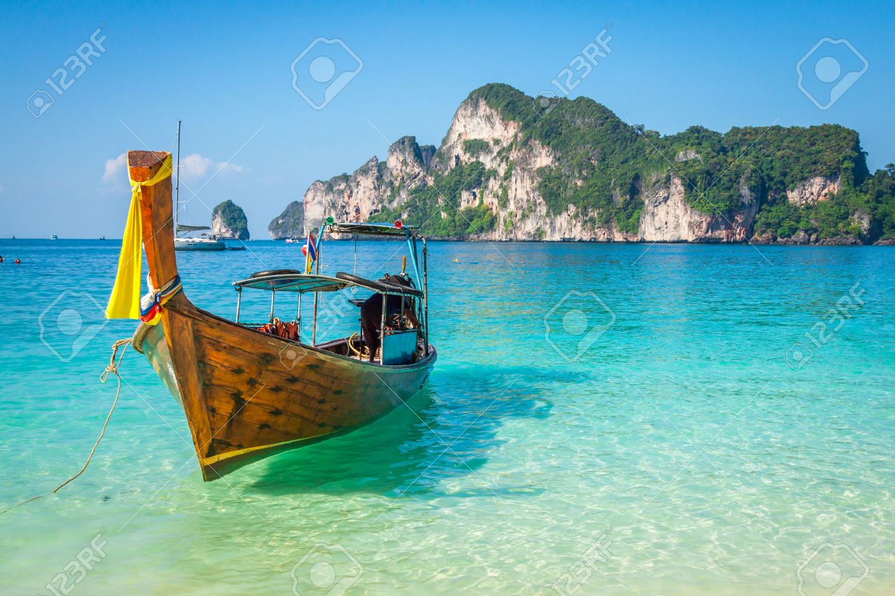39505382-Long-boat-and-tropical-beach-An