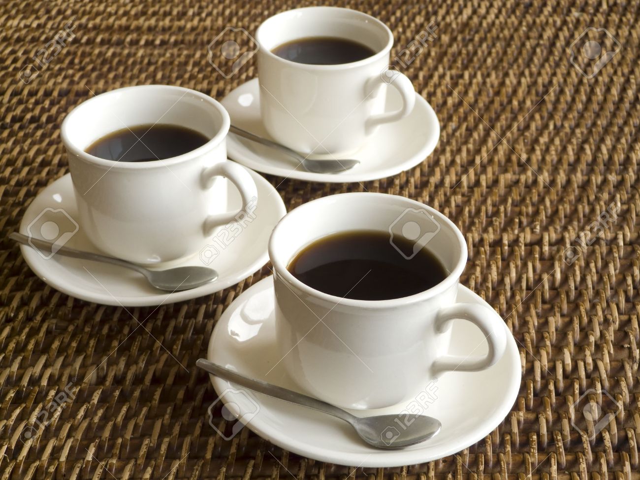 2451372-Three-cups-of-coffee-on-a-table-Stock-Photo.jpg