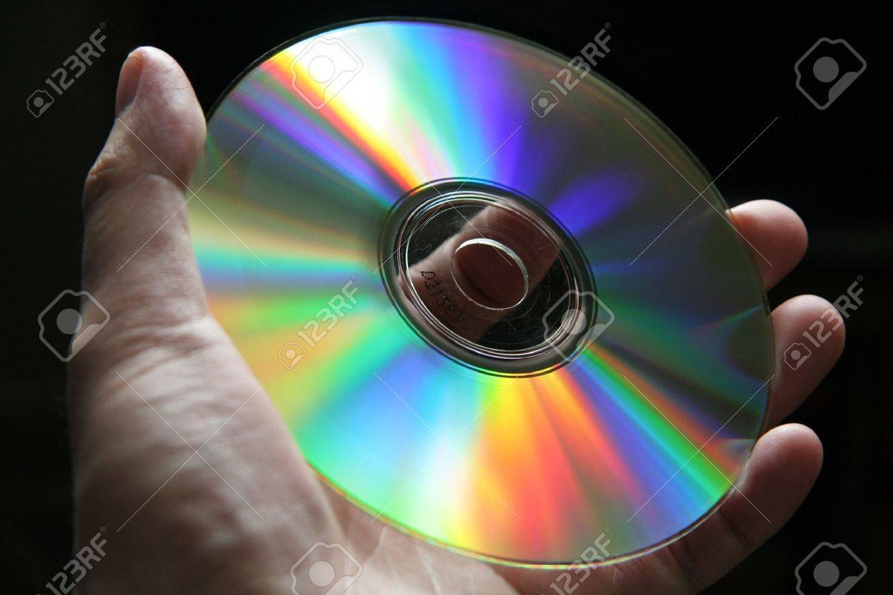 391446-CD-Disk-with-rainbow-reflections-Stock-Photo.jpg