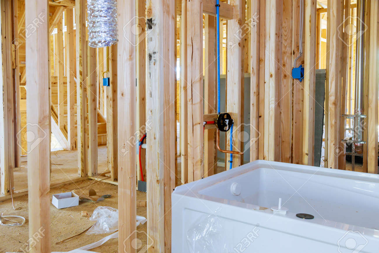 The Complete Guide to Bathroom Remodeling: Design, Budget, Materials & What to Expect 1 https://previews.123rf.com/images/photovs/photovs2005/photovs200500034/146488859-new-under-construction-bathroom-with-interior-framing-of-bathroom-a-new-acrylic-bathtub.jpg