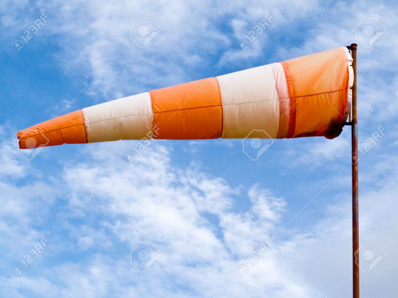 http://previews.123rf.com/images/pilens/pilens1110/pilens111000016/11010231-Red-and-white-windsock-wind-filled-partially-clouded-blue-sky--Stock-Photo.jpg