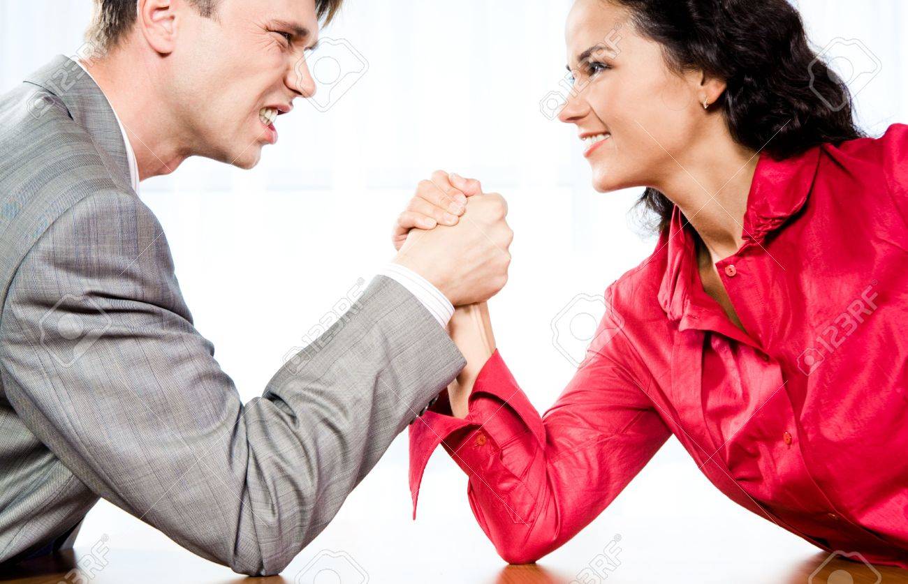 http://previews.123rf.com/images/pressmaster/pressmaster0810/pressmaster081000302/3715907-Portrait-of-smiling-woman-and-angry-man-fighting-by-their-arms-Stock-Photo.jpg