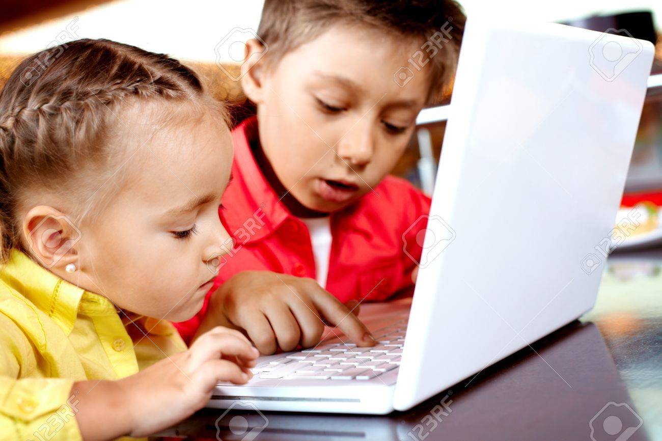 Worksheet Typing For Kid portrait of cute children typing on laptop stock photo picture 9726246