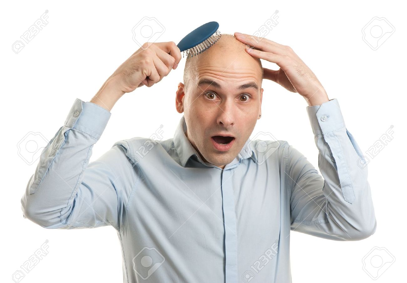 16763121-Shocked-bald-man-holding-comb-S