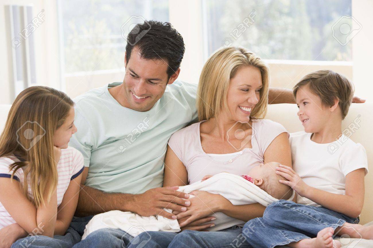 Living Room Family In Living Room family in living room with baby smiling stock photo picture and smiling