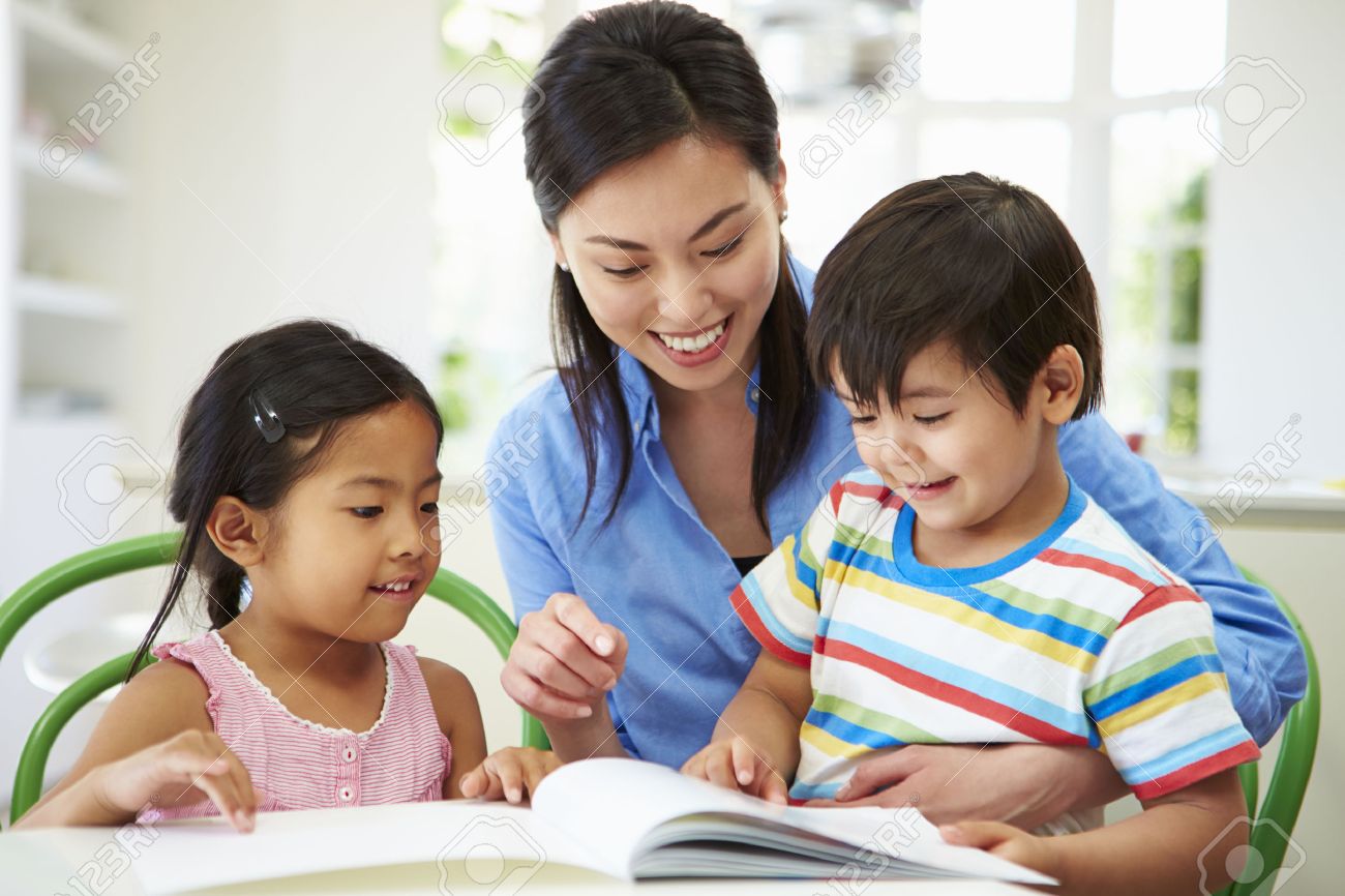 Worksheet Helping A Child Read 20s read stock photos images royalty free and mother helping children with homework photo