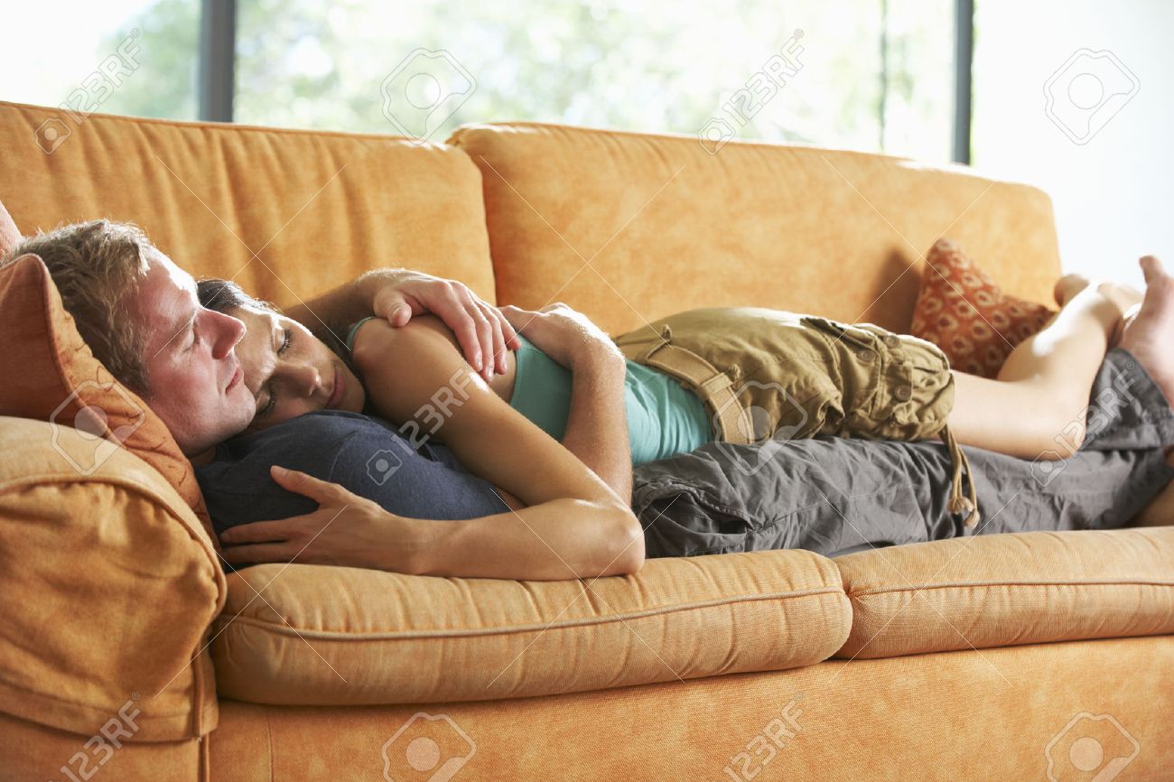 42255741-Romantic-Couple-Lying-On-Sofa-At-Home-Stock-Photo-sleeping.jpg