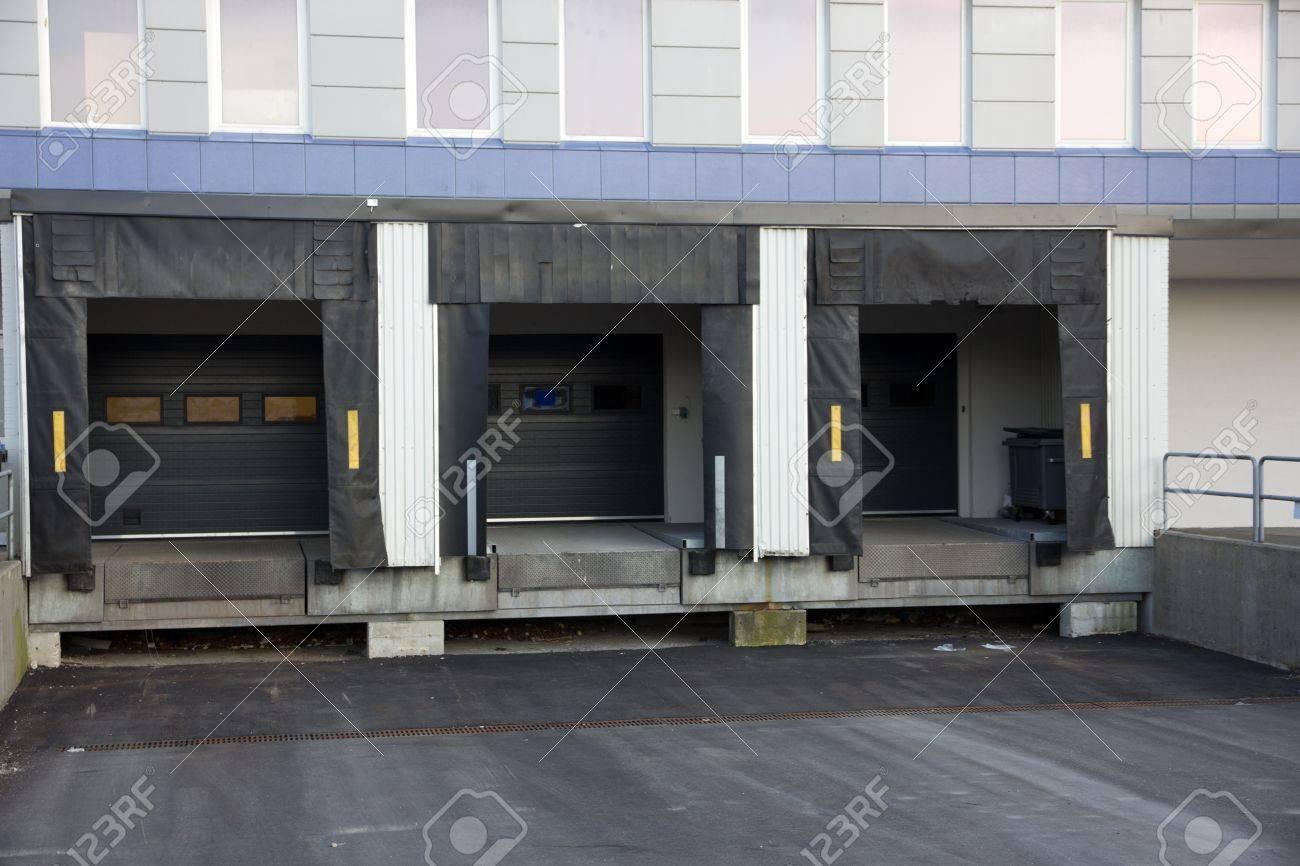 14017997-Picture-of-three-loading-docks-used-for-trucks-to-unload-goods-Stock-Photo.jpg