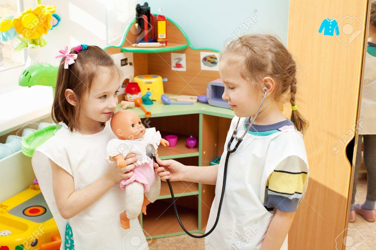 Worksheet Kindergarten Kids child in kindergarten kids nursery school girl playing with doll at infant school