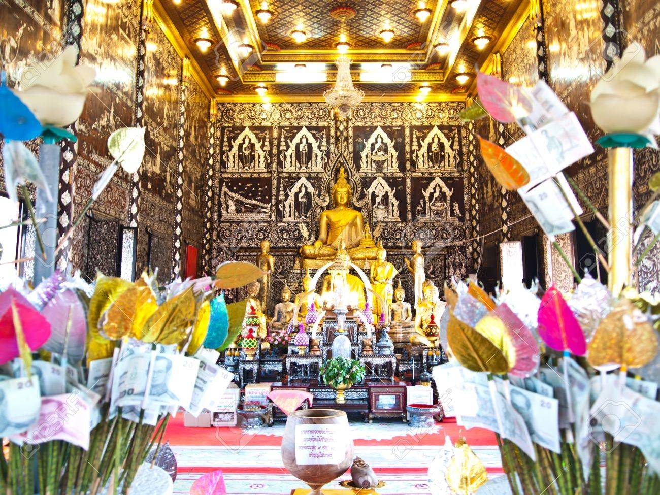 http://previews.123rf.com/images/thaifairs/thaifairs1108/thaifairs110800023/10105199-The-golden-buddha-and-Money-tree-at-Buddhist-temple-in-Thailand-consisting-of-banknotes-donated-by-v-Stock-Photo.jpg