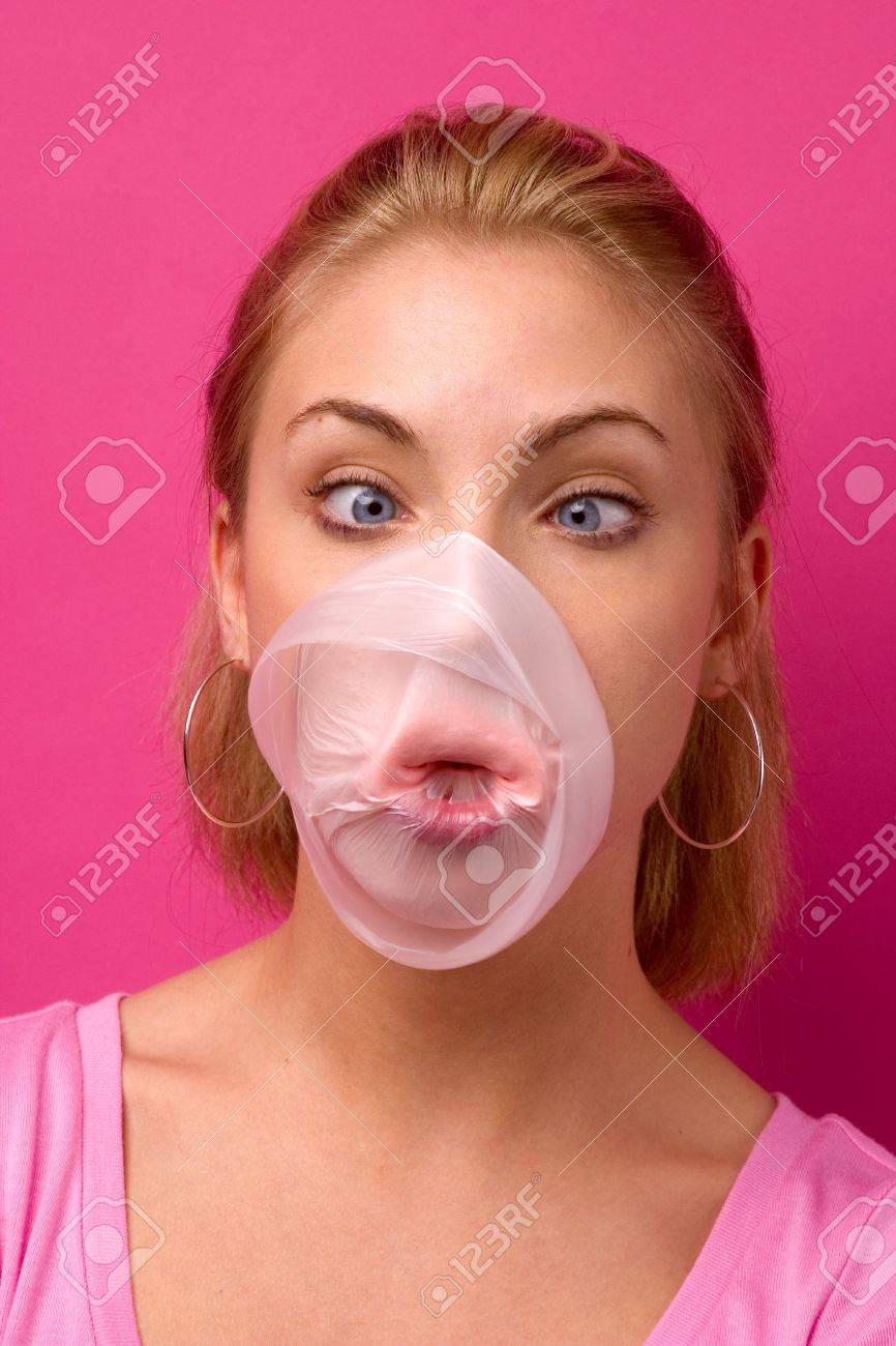 438869-big-bubble-gum-bubble-popping-on-a-girl-s-face-Stock-Photo.jpg