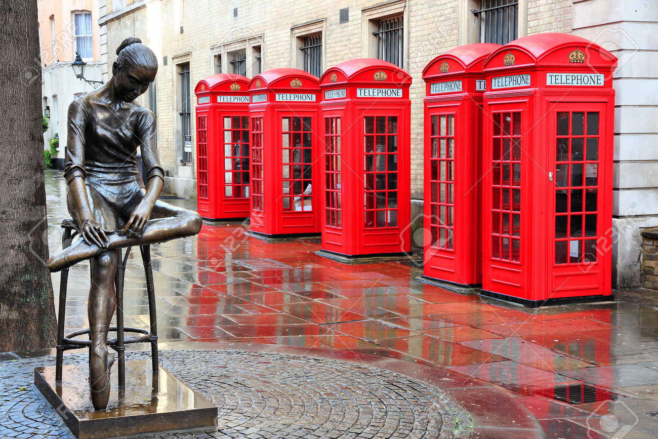 18280220-London-United-Kingdom-red-telephone-boxes-in-wet-rainy-weather-View-of-Broad-Court-Covent-Garden--Stock-Photo.jpg