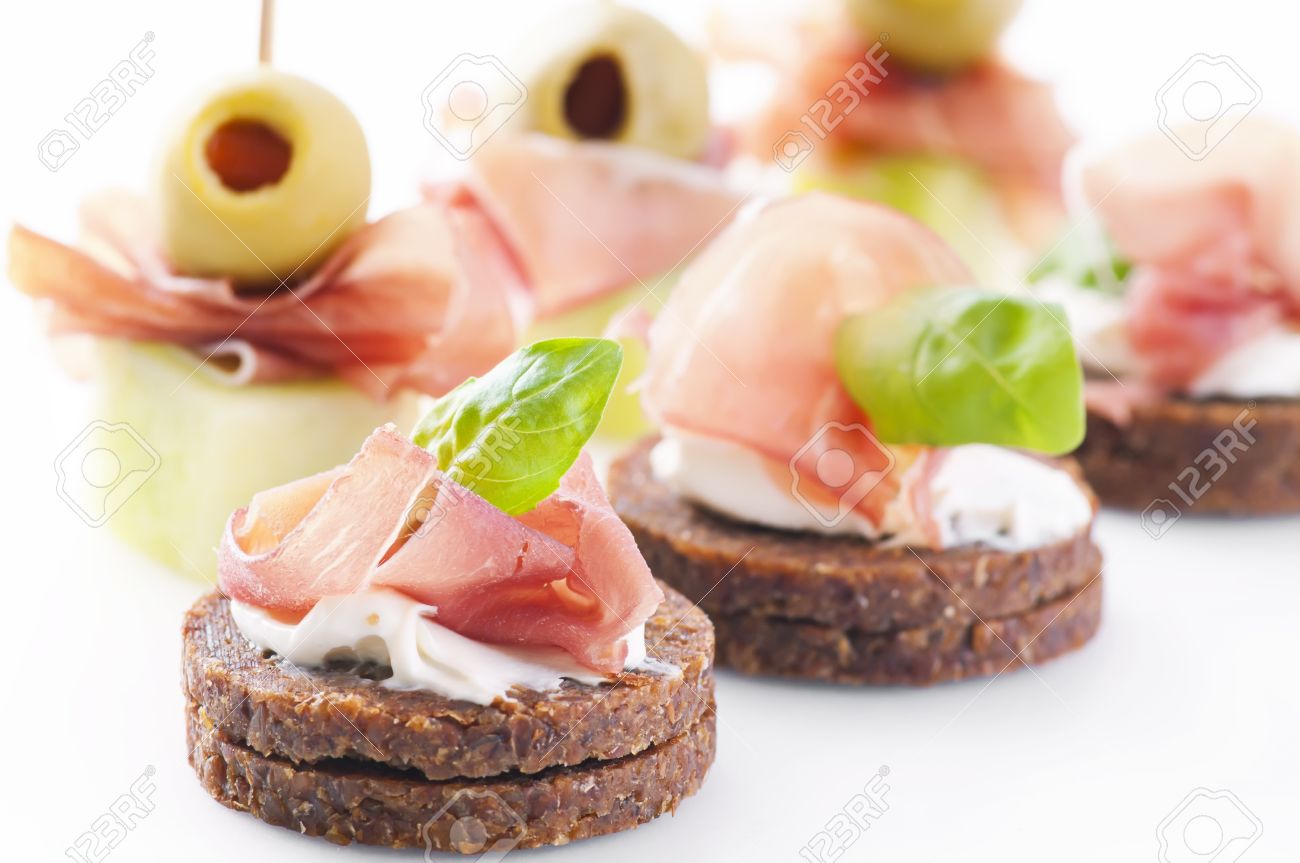 Canapes with ham and pickled olives stock photo, picture and ...