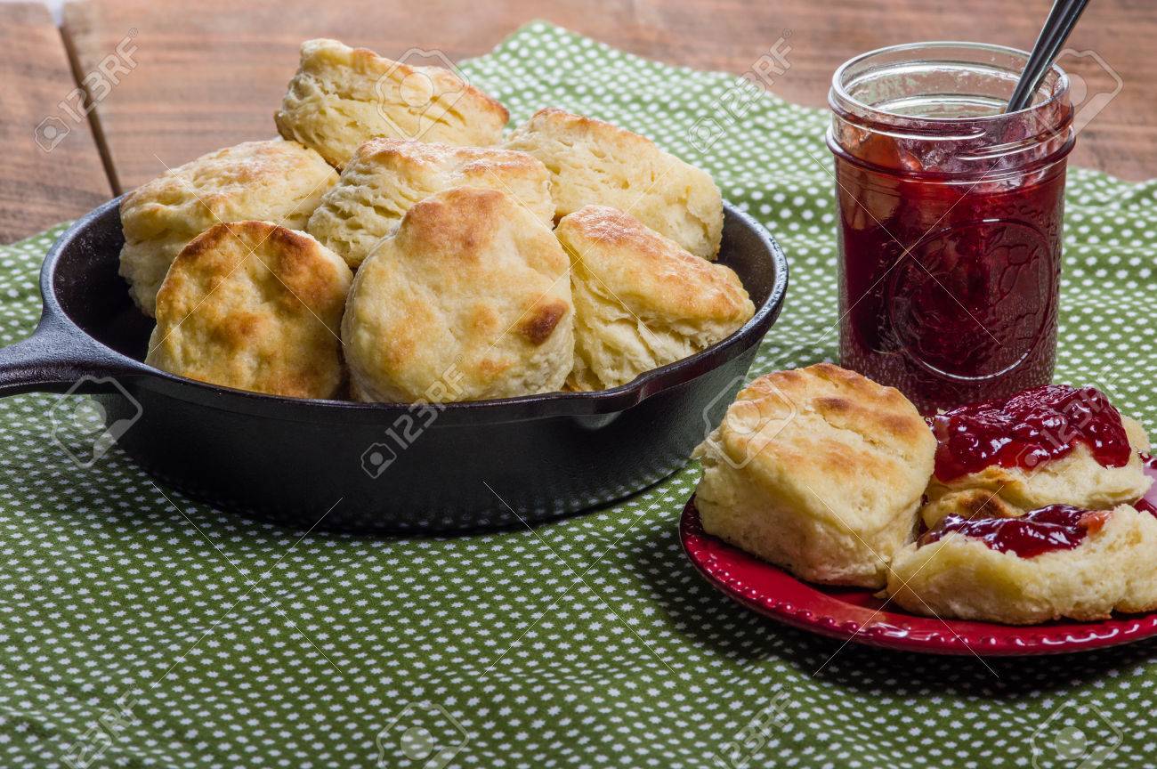 37571865-Cast-iron-skillet-of-fresh-biscuits-or-scones-with-jam-or-jelly-Stock-Photo.jpg