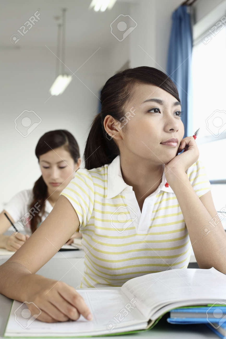 young woman daydreaming in class stock photo picture and royalty daydreaming in class