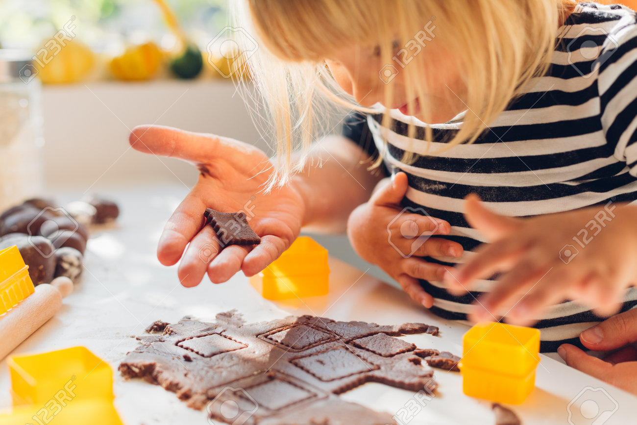 closeup of little grild make cakes with mom stock photo picture and