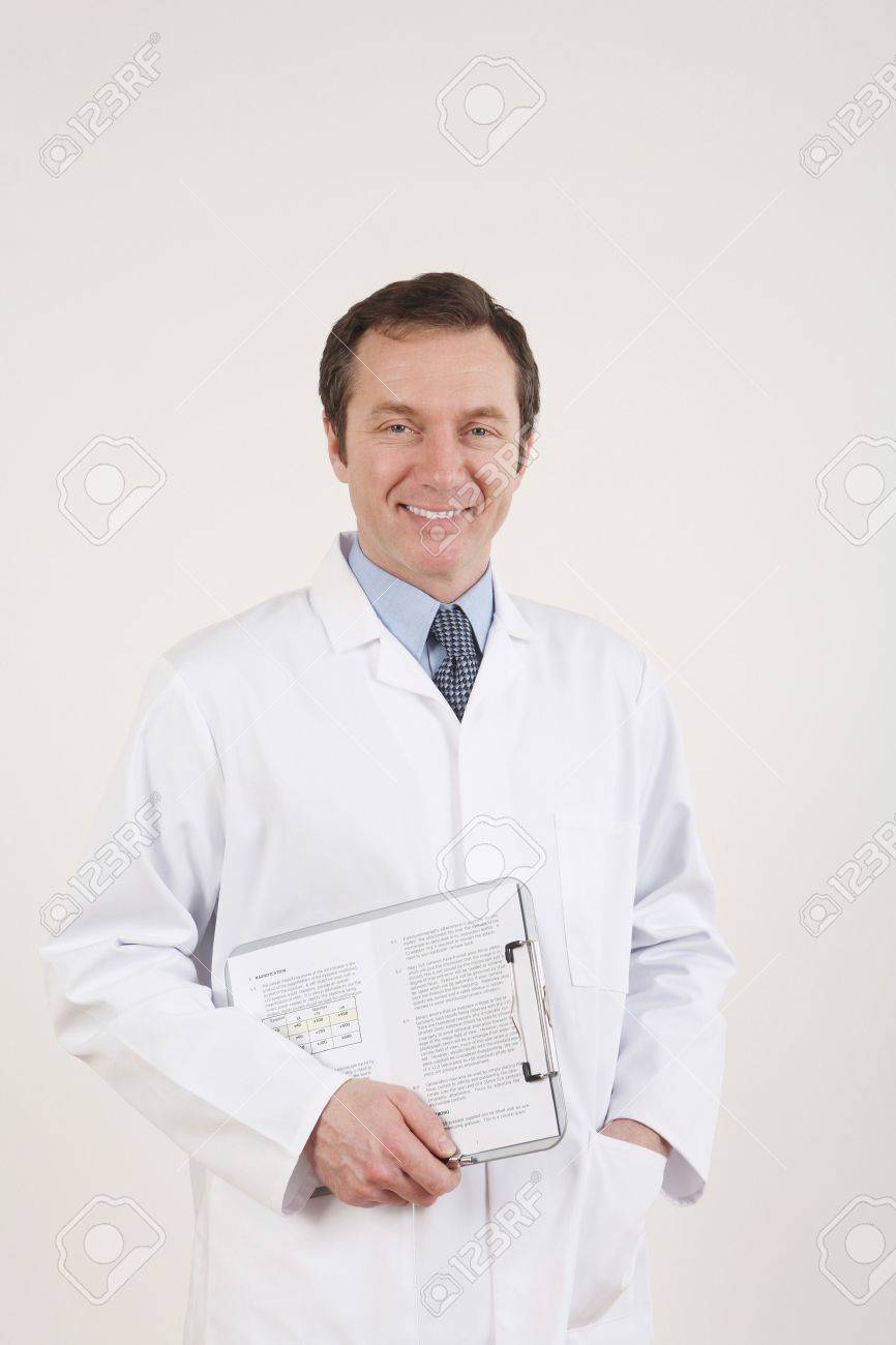 Man In Lab Coat Holding A Clipboard Stock Photo Picture And Royalty Free Image Image 3205454