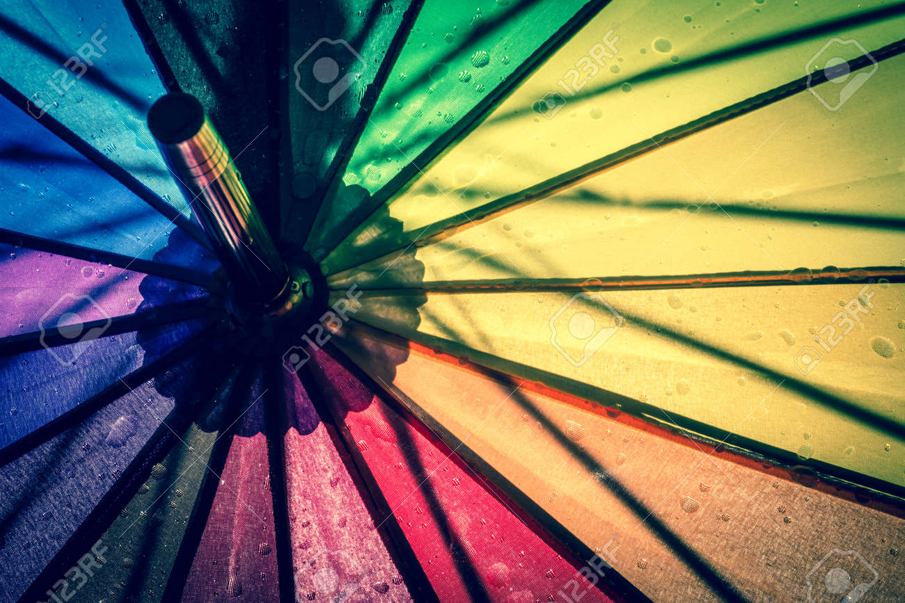 multi colored colorful umbrella with all colors of the rainbow