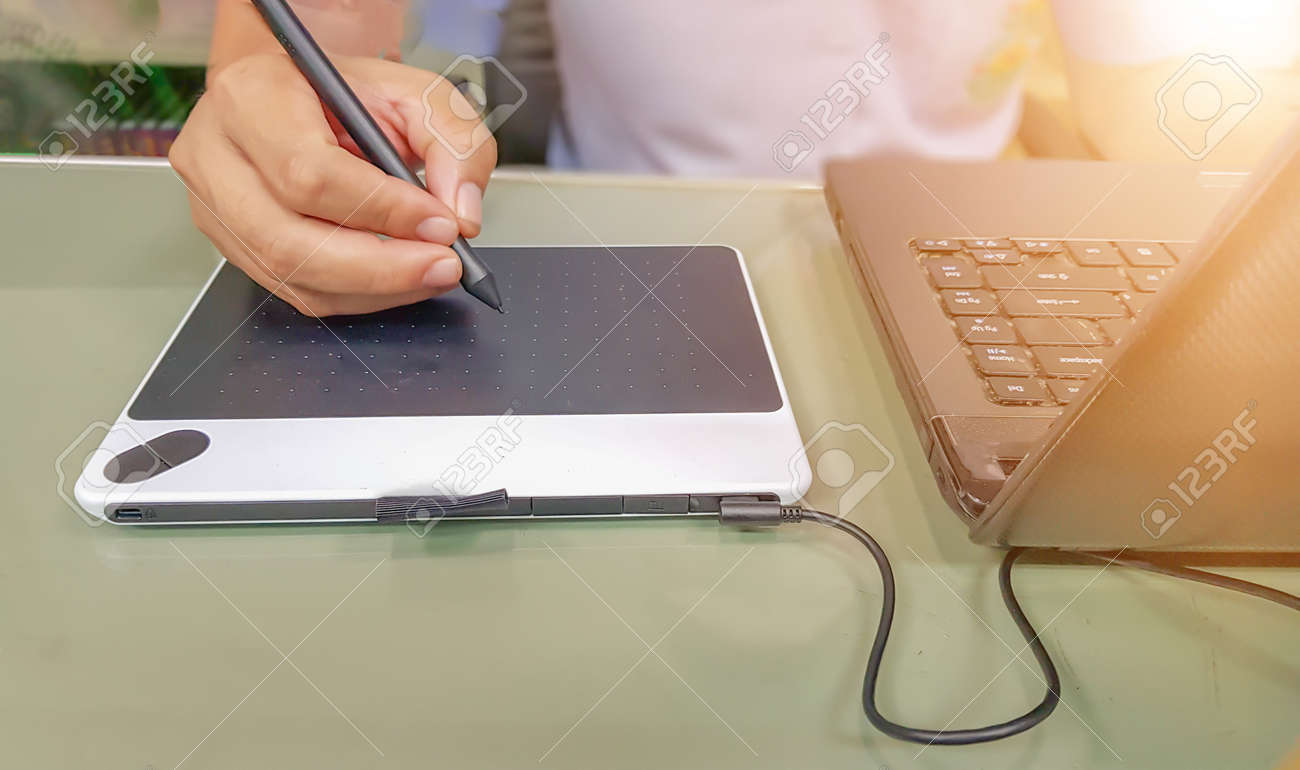 Middle Aged Men Are Using The Pen Mouse In The Computer Drawing Stock Photo Picture And Royalty Free Image Image 107083249