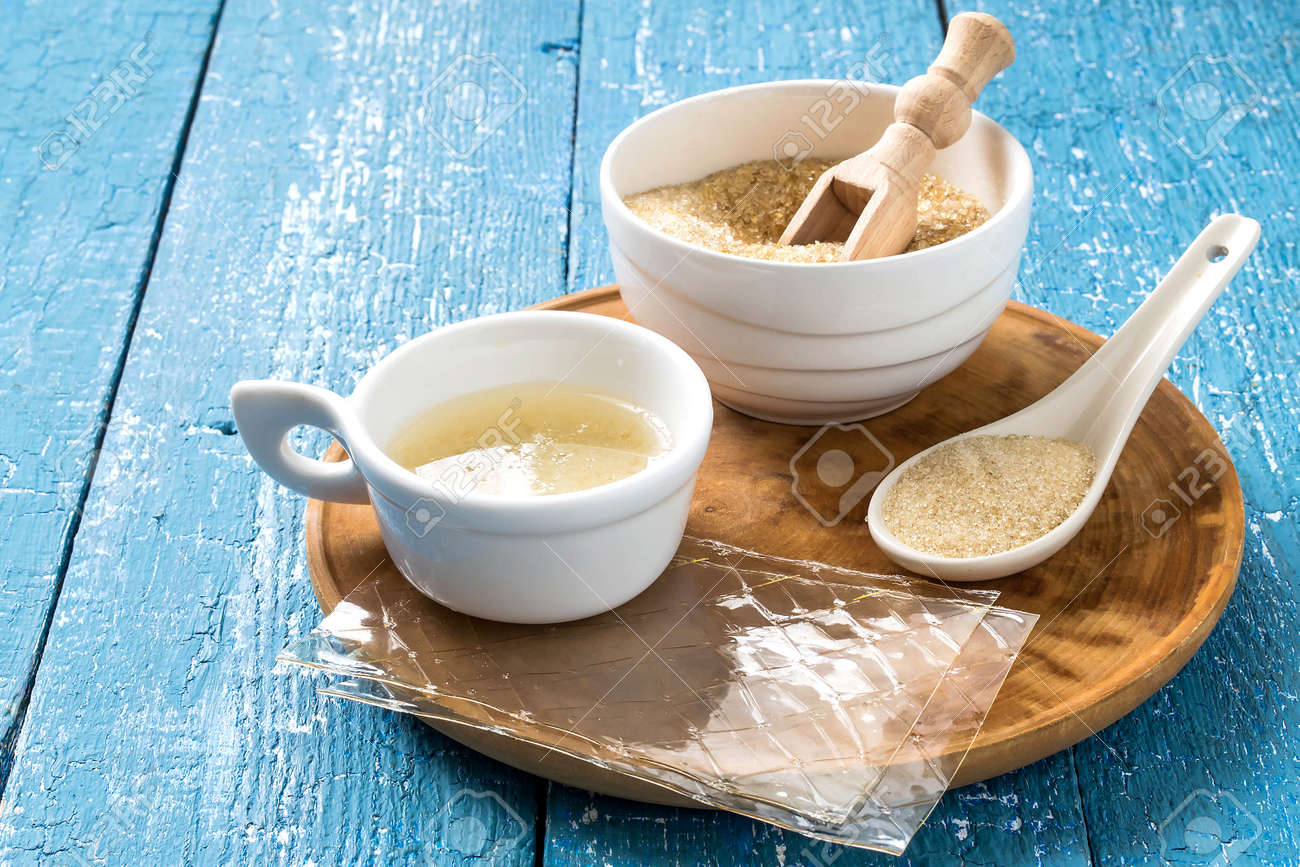 Different Types Of Gelatin Powder Granules Sheets And Gelatin Solution On A Blue Wooden Table Stock Photo Picture And Royalty Free Image Image 51866034