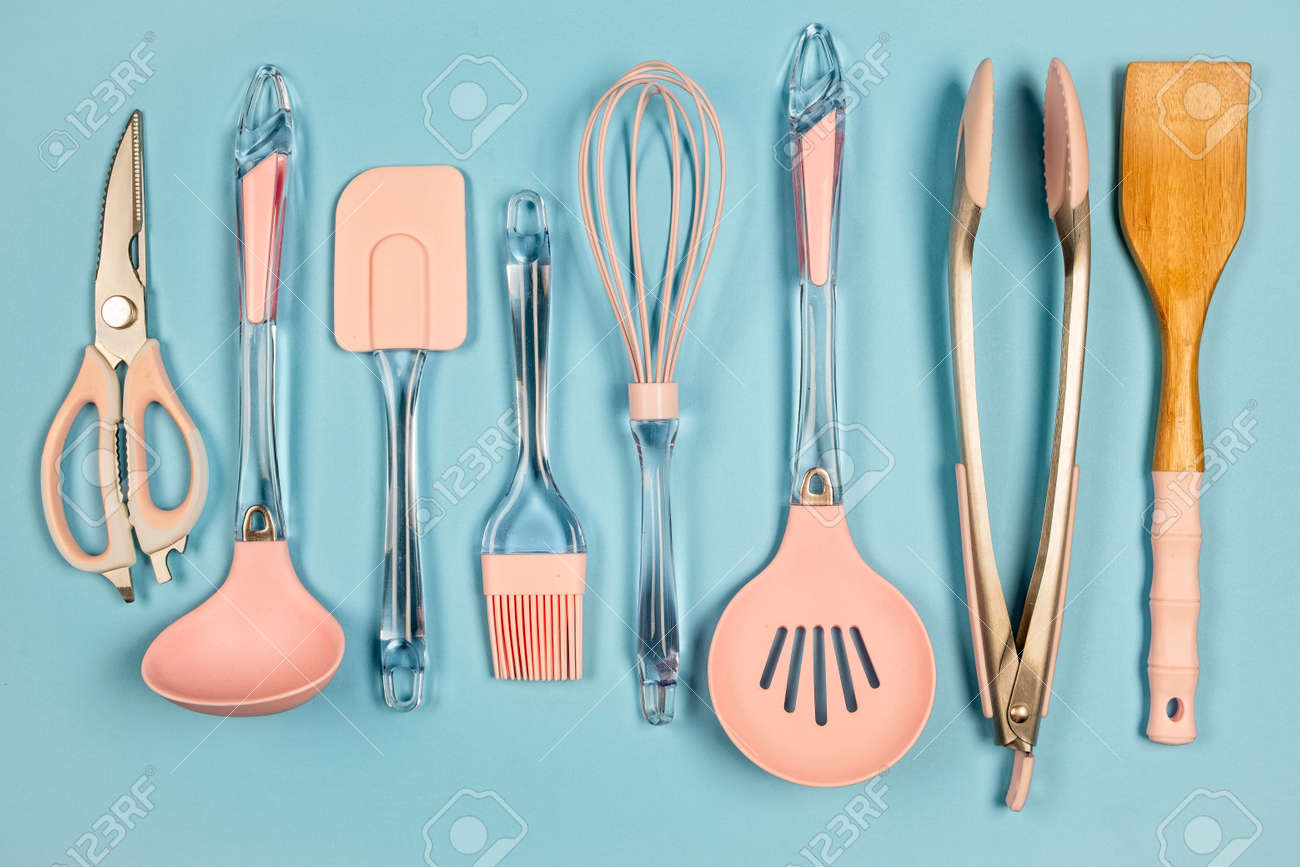 Mix Of Metal And Silicone Kitchen Utensils In Pink Color On Blue Stock Photo Picture And Royalty Free Image Image 142534207