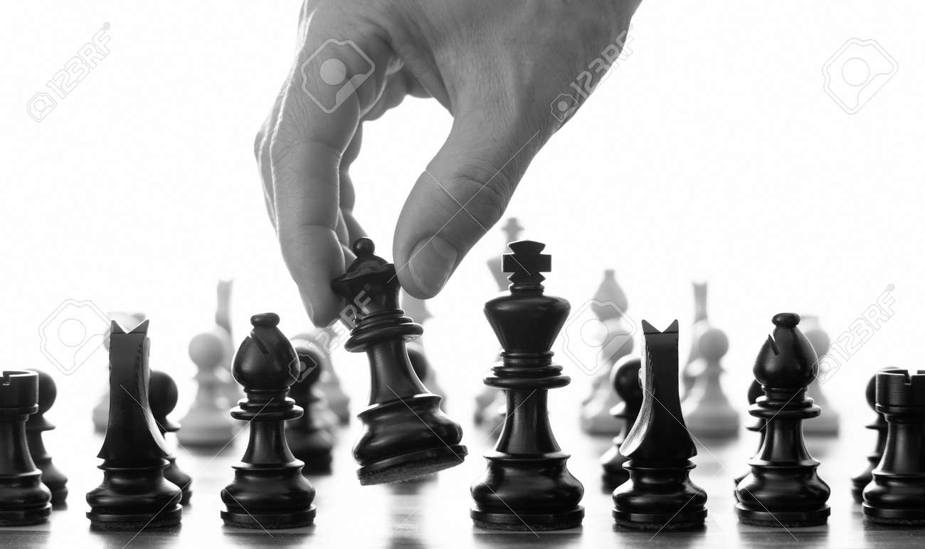 6161825 Chess Move With Hand Picking Up The Queen Black And White Stock Photo Jpg 1300 772 Day Trading Trading Strategies Day